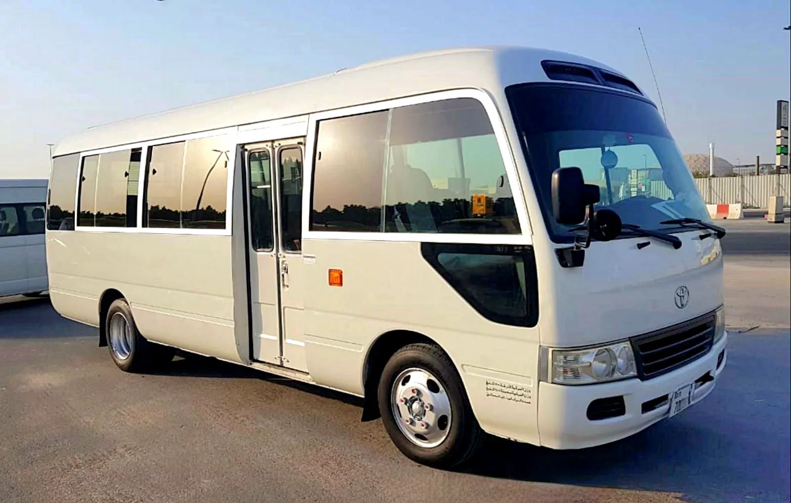 Dubai Airport Transfer by AAli bus rent gallery image