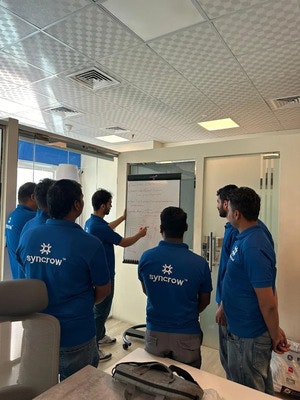 Syncrow - Smart Building & IoT Solutions - Screenshot 4 showing product features and functionality